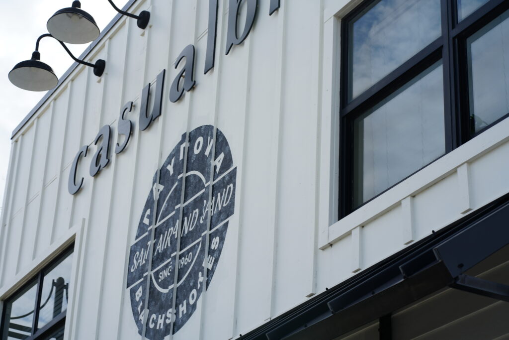 Exterior wall of Casual Bird with retro-style Daytona Beach Shores emblem