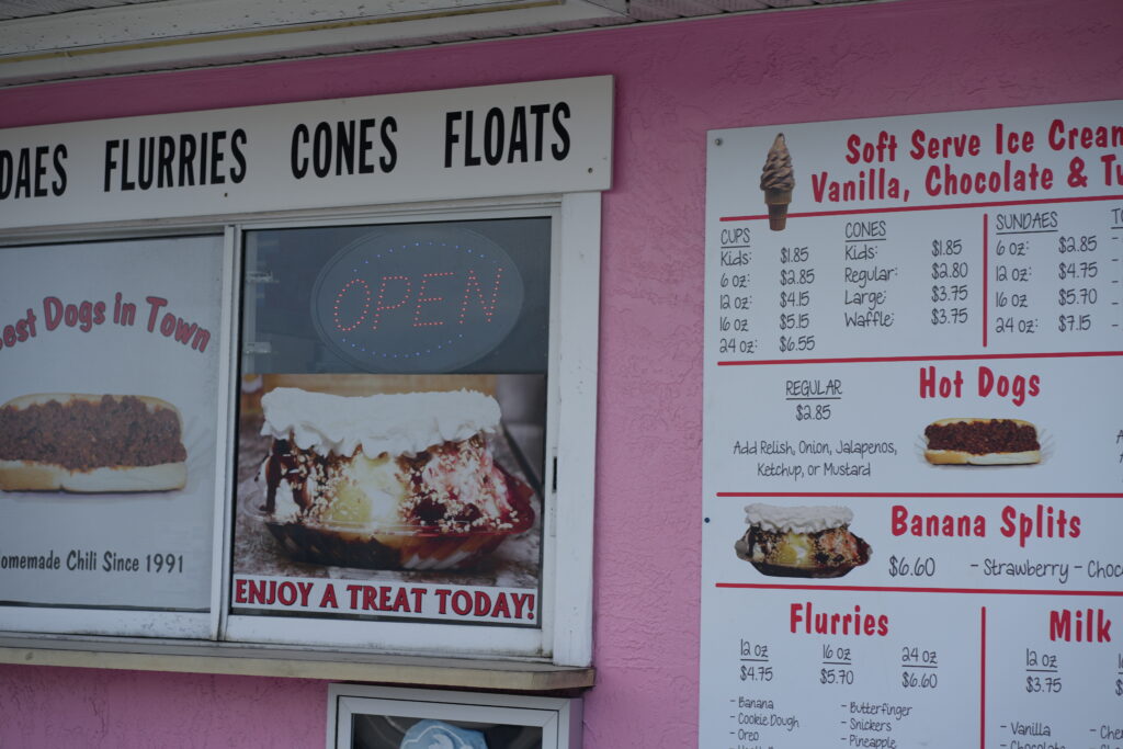 Vintage-style ice cream and hot dog menu at The Dairy Bar in Daytona Beach, featuring soft serve, banana splits, and chili dogs.